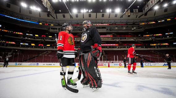 Megan on the ice with her favorite hockey team, the Chicago Blackhawks 