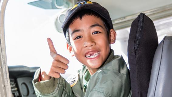 Kyer having a blast in the plane's cockpit