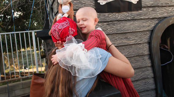 Leona hugging mom in pirate costumer