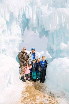 Wish kid Shore and her family stand in the snow during her wish.