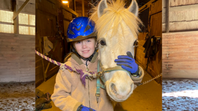 Elizabeth with her white horse, Prince Aladdin, in the barn.