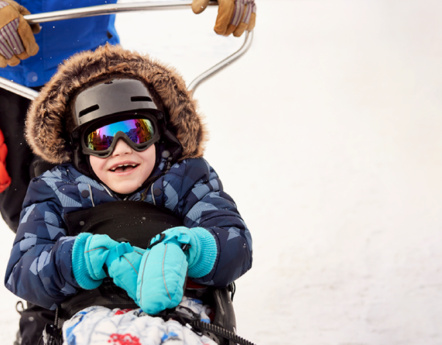 Wish kid Gage skiing